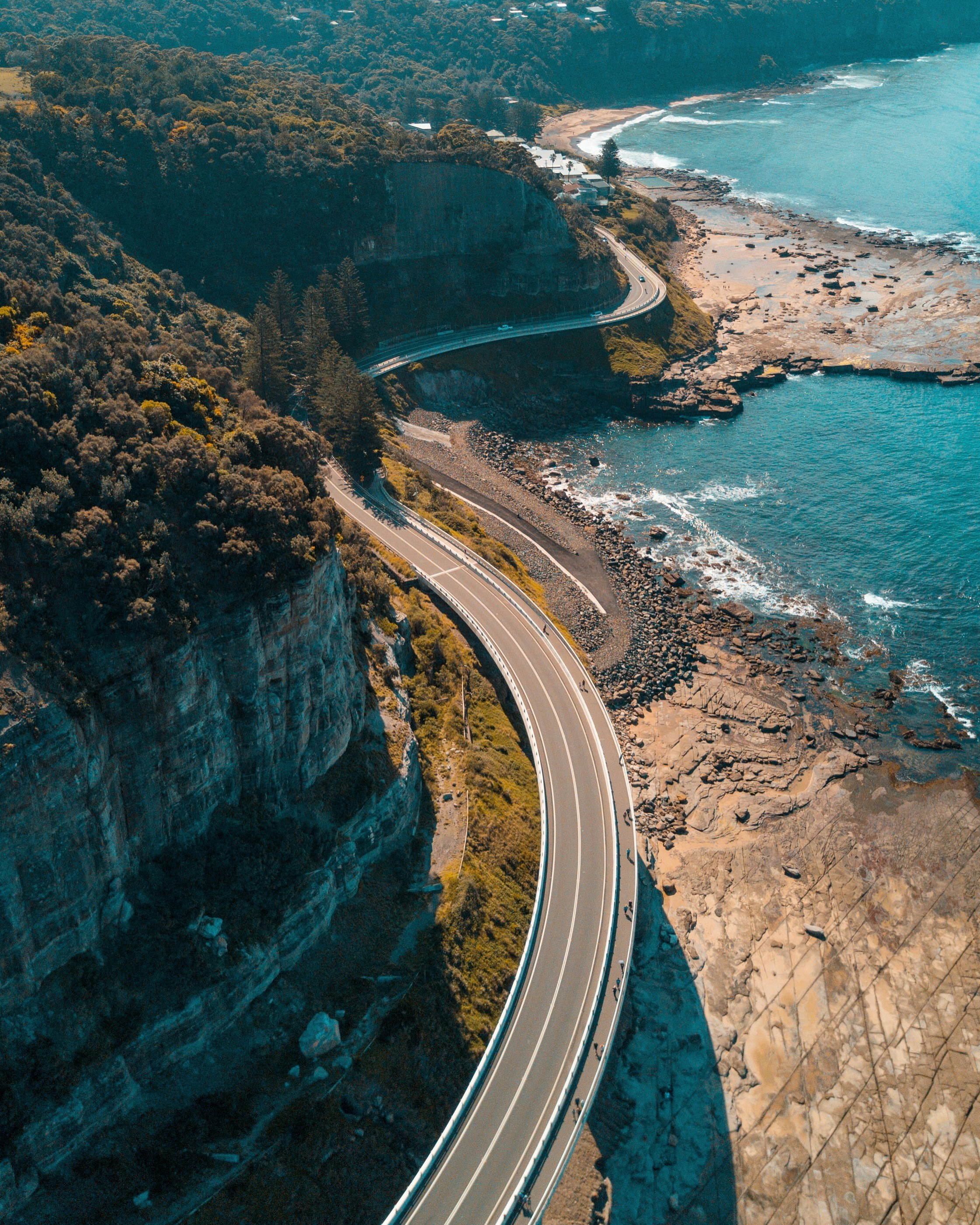 Aerial view of the Sea Cliff Bridge curving along the New South Wales coastline